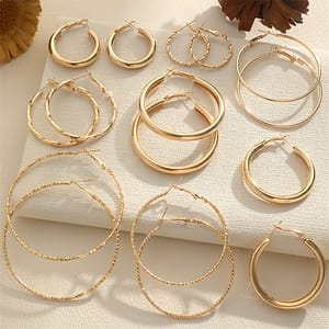 A Set Of 8 Pairs Of Simple And Stylish Twisted Wave Sparkling Earrings In Golden And Silvery Colors. Clothing, Shoes & Jewelry Shop Online at Dubai Trades